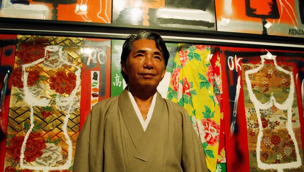FILE PHOTO: Japanese designer Kenzo Takada, also known as Kenzo, poses for the media in front of his works at an art gallery in Buenos Aires, April 7, 2009