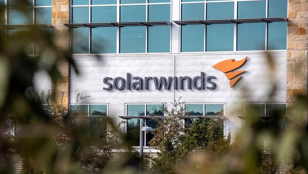 FILE PHOTO: The SolarWinds logo is seen outside its headquarters in Austin, Texas, U.S., December 18, 2020.  - Sputnik 日本