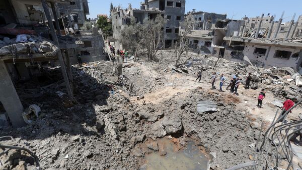 Палестинцы собираются на месте разрушенных домов после израильских авиационных и артиллерийских ударов в секторе Газа - Sputnik 日本