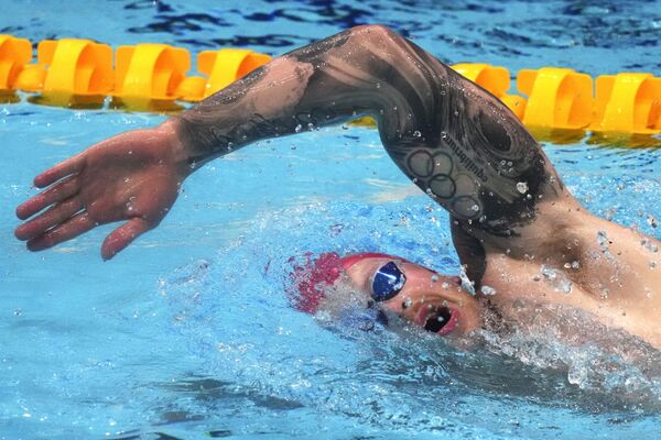 左腕にオリンピックシンボルのタトゥーを入れた英国のアダム・ピーティ選手（競泳） - Sputnik 日本