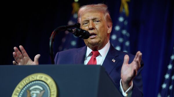 President Donald Trump speaks to House Republican lawmakers during their annual policy retreat, Tuesday, Jan. 6, 2026, in Washington - Sputnik 日本