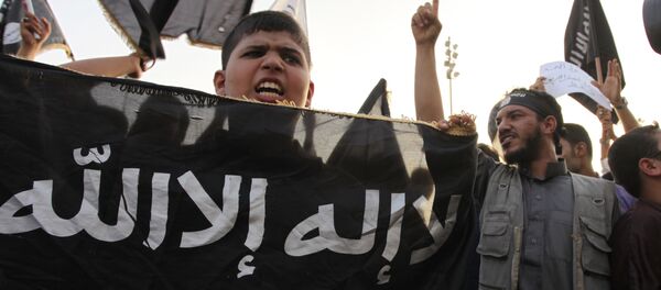 In this Friday, Sept. 14, 2012 file photo, Libyan followers of Ansar al-Shariah Brigades chant anti-U.S. slogans during a protest in front of the Tibesti Hotel, in Benghazi, Libya, as part of widespread anger across the Muslim world about a film ridiculing Islam's Prophet Muhammad - Sputnik 日本