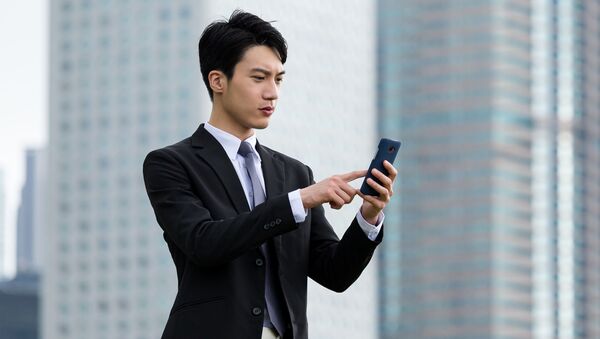 Китайский бизнесмен с телефоном - Sputnik 日本