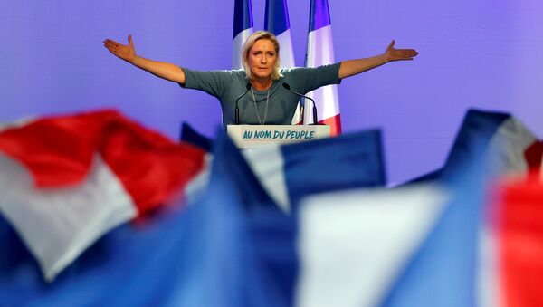 Marine Le Pen, French National Front (FN) political party leader, gestures during an FN political rally in Frejus - Sputnik 日本