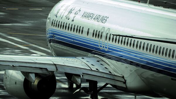 中国人女性　好奇心から離陸前に旅客機の非常口を開ける【写真】 - Sputnik 日本