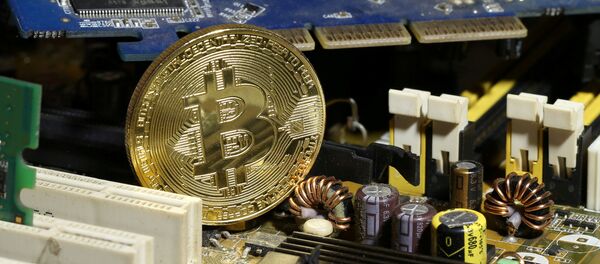 A copy of bitcoin standing on PC motherboard is seen in this illustration picture, October 26, 2017 A copy of bitcoin standing on PC motherboard is seen in this illustration picture, October 26, 2017 - Sputnik 日本