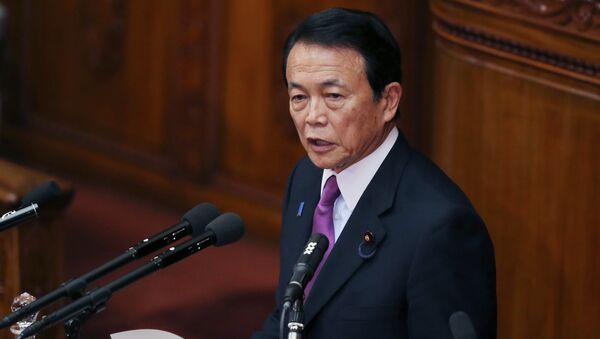 Japan's Finance Minister Taro Aso speaks during a opening session at the lower house of Parliament in Tokyo, Monday, Jan. 26, 2015 - Sputnik 日本