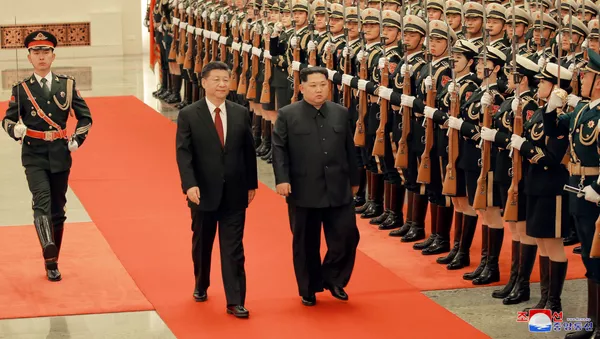 北京での習近平国家主席と金正恩委員長