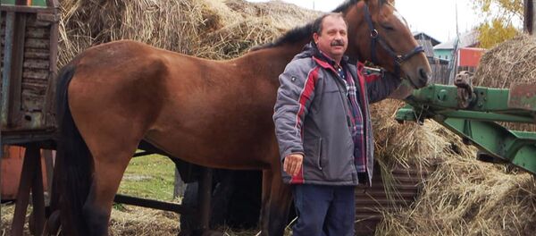 Депутат законодательного собрания Камчатского края Михаил Пучковский и его конь Ракета - Sputnik 日本