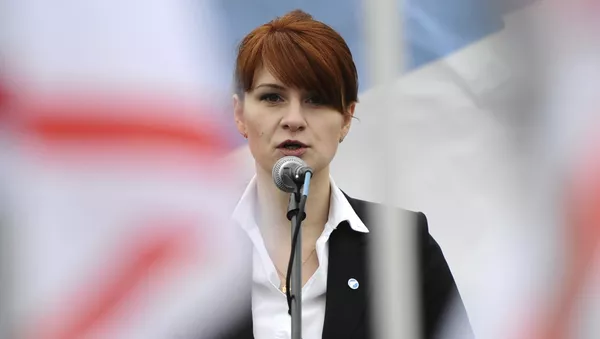 In this photo taken on Sunday, April 21, 2013, Maria Butina, leader of a pro-gun organization in Russia, speaks to a crowd during a rally in support of legalizing the possession of handguns in Moscow, Russia