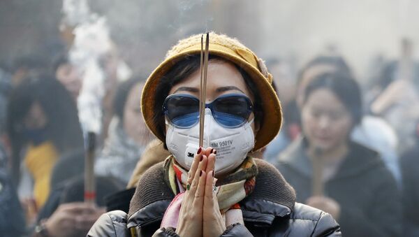 北京　お祈りしている女の人 - Sputnik 日本